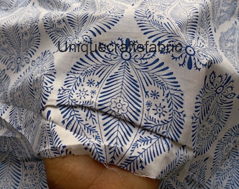 May include: White cotton fabric with a blue paisley pattern. The fabric is folded in half and the pattern is visible on both sides.