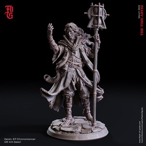 May include: A detailed miniature figurine of an elf chronomancer, painted in a muted brown color scheme. The elf is wearing a long robe with intricate details and holds a staff topped with an hourglass. The base is a circular stone platform.