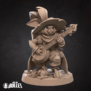 May include: A brown rabbit figurine wearing a hat and playing a banjo. The rabbit has a backpack and is standing on a circular base with a textured surface.