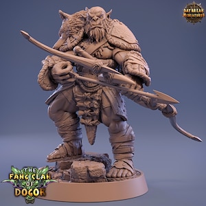 May include: A brown, unpainted miniature figurine of an Orc warrior with a wolf head helmet, holding a bow and arrow. The figurine is standing on a rocky base. The text "The Fang Clan of Dogor" is printed on the base.