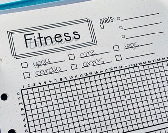May include: A black and white fitness tracker with a grid for logging workouts. The tracker includes sections for yoga, cardio, core, and arms. It also has a section for goals with lines for writing in goals. The tracker has a calendar with the months of the year listed on the left side and numbers 1 through 30 listed across the top.
