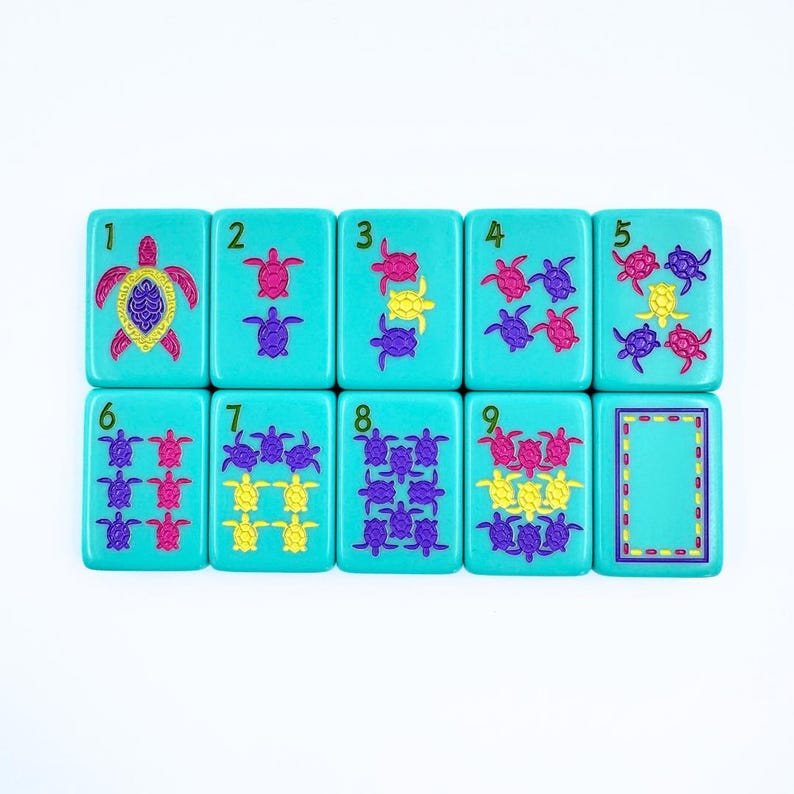 May include: Nine turquoise tiles with numbers 1 through 9 and images of sea turtles. The tiles are arranged in a row. The turtles are in various colors and patterns.