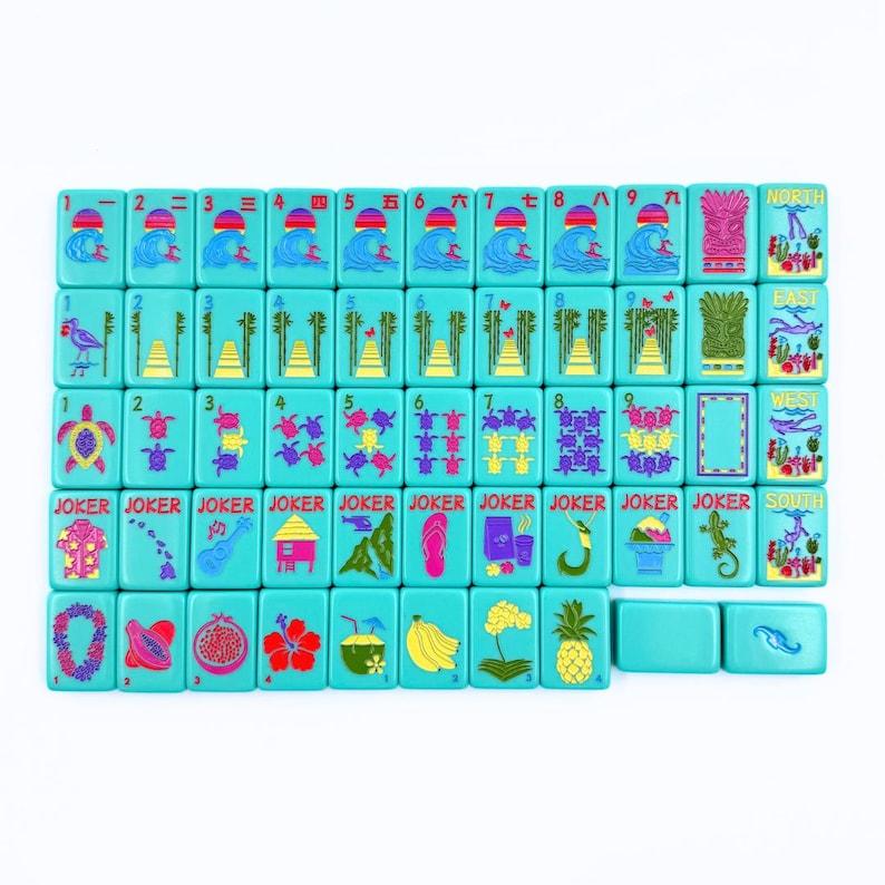 May include: A set of 36 turquoise blue dominoes with colorful images and numbers. The dominoes feature images of a pineapple, a coconut, a banana, a hibiscus flower, a lei, a papaya, a pomegranate, a hut, a turtle, a surfboard, a wave, a bird, a bamboo forest, and a joker. The dominoes are arranged in a grid pattern with the numbers 1 through 9 and the words "North", "East", "West", and "South" on the sides.