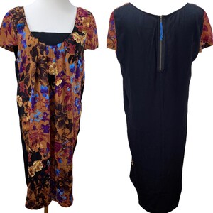 May include: A black and brown floral print dress with short sleeves and a back zipper. The dress has a black bodice and a floral print skirt.