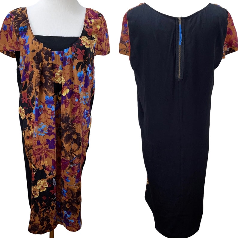 May include: A black and brown floral print dress with short sleeves and a back zipper. The dress has a black bodice and a floral print skirt.