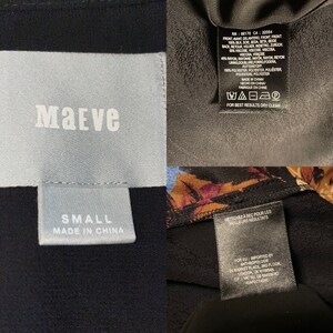 May include: A black and white tag with the word "Maeve" in white text. Below the word "Maeve" is a smaller tag that says "Small" and "Made in China". A black tag with white text that says "For best results dry clean" and a black tag with white text that says "Imported by Anthropologie 14 Market Place, 3rd Floor, London, UK WIWBAN CIF: VAT NO GB 654336382 SAFECY4000" are also visible.
