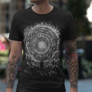 May include: A black t-shirt featuring a white graphic print of a swirling vortex with a bright white centre.
