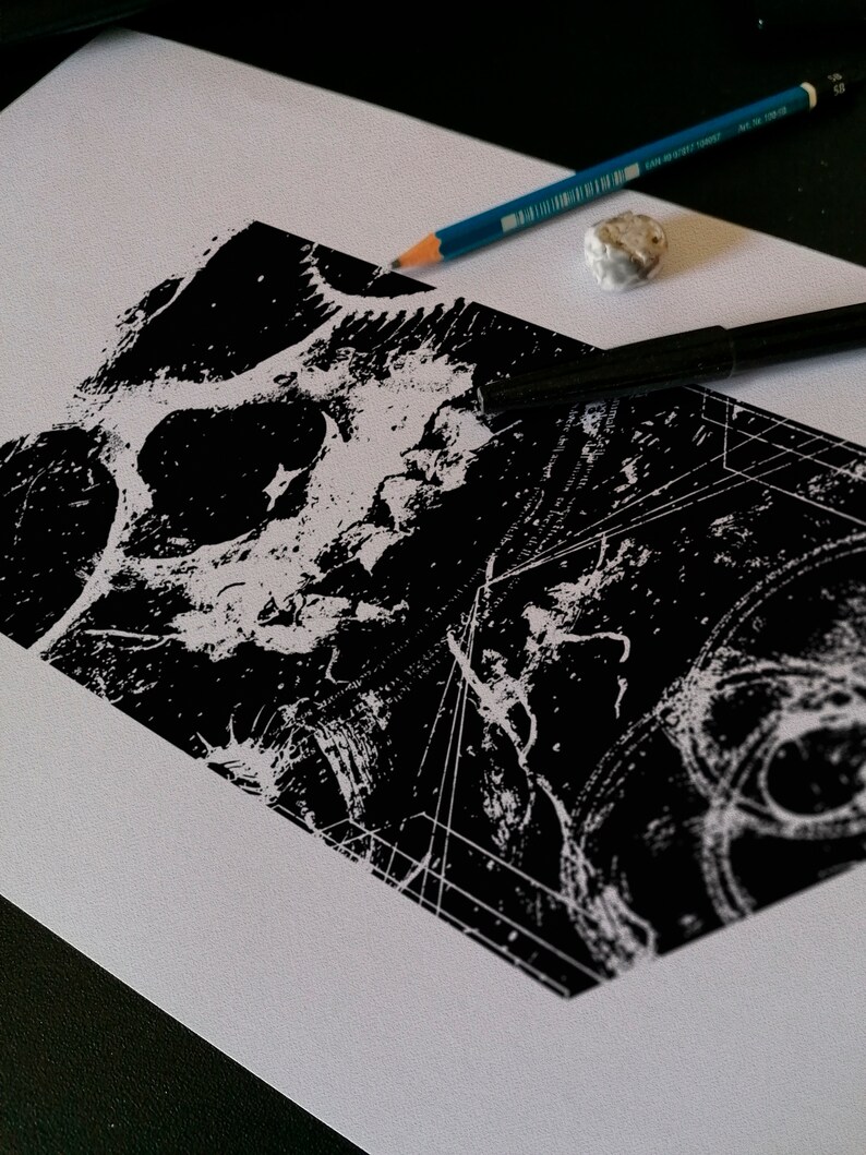 May include: A black and white abstract print with geometric shapes and a textured background. The print is on a white sheet of paper.