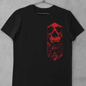 K&ouml;nnte beinhalten: Schwarzes T-Shirt mit einem roten Grafikdruck eines Sch&auml;dels mit geometrischem Design.