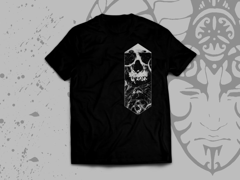 May include: Black t-shirt with a white graphic of a skull in a geometric shape.