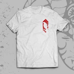 May include: White t-shirt with a red graphic of a stylized bird inside a hexagon.
