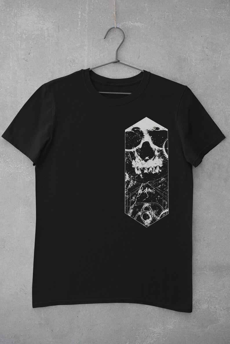 May include: Black t-shirt with a white graphic of a skull with gears and a geometric shape.
