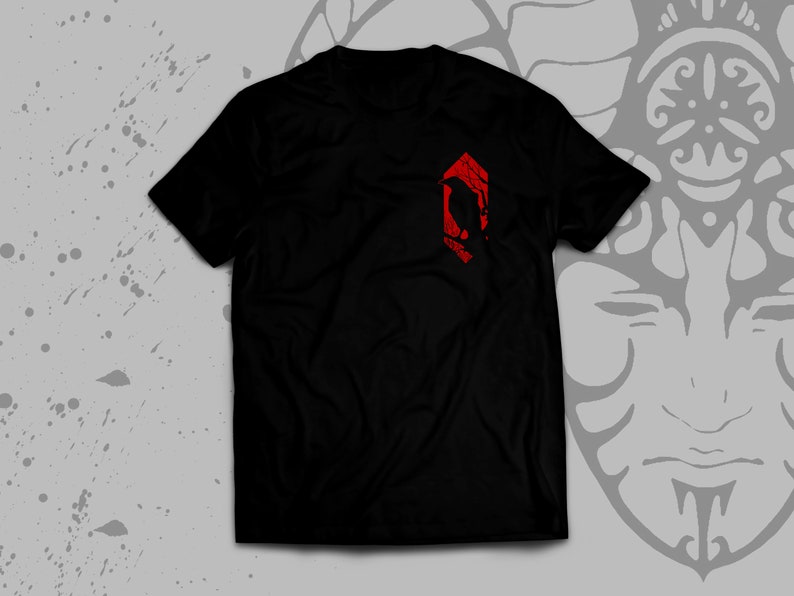 May include: Black t-shirt with a red geometric design featuring a stylized bird silhouette.