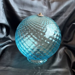 Large blown glass ball. Blue color. Brass finishes Chandelier cups Spare parts for lamps or chandeliers in the shape of a ball. Blown glass.