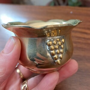 Small bowl in heavy brass decorated with a bunch of grapes Handmade Signed by the author on the bottom Collectible brass Vintage Italy