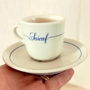 Exclusivo juego de 6 tazas de café espresso coleccionables "Saicaf Caffè" en porcelana gruesa color blanco hueso "IPA". Fabricadas en Italia.