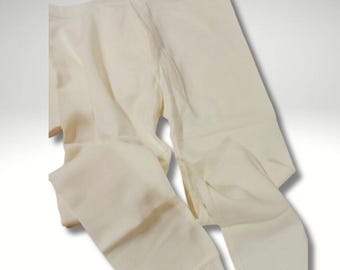 May include: A pair of white thermal leggings. The leggings are made of a soft, stretchy fabric and are perfect for layering in cold weather.