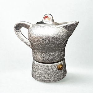 Rara caffettiera da collezione in porcellana e alluminio da 1 tazza mai usata. Rivestita in argento.