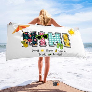 May include: White beach towel with the word "MIMI" in colourful patchwork letters. The letters are decorated with flowers, pineapples, sunglasses, and flip-flops. Below the word "MIMI" are the names David, Nicky, Brady, Sophia, and Amabel.