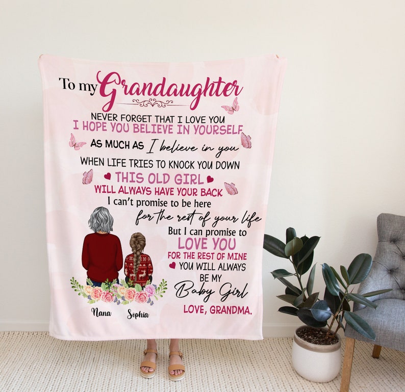 May include: Pink and white blanket with a message to a granddaughter. The message reads "To my Grandaughter Never forget that I love you I hope you believe in yourself as much as I believe in you When life tries to knock you down This old girl will always have your back I can't promise to be here for the rest of your life But I can promise to love you for the rest of mine You will always be my Baby Girl Love, Grandma."