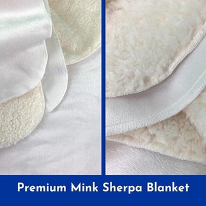 May include: Close-up of a white blanket with a soft, plush texture. The blanket is made of two layers, a smooth outer layer and a fluffy inner layer. The blanket is folded in half, showing the different layers.  Premium Mink Sherpa Blanket.