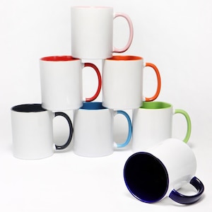 May include: A stack of eight white ceramic mugs with different colored rims. The mugs are arranged in a pyramid shape with the top mug having a pink rim, the second row having a red rim and an orange rim, the third row having a blue rim, a green rim, and a black rim, and the bottom row having a blue rim.