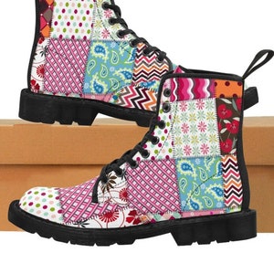 May include: Black lace-up boots with a patchwork design featuring various colorful patterns, including floral, paisley, and geometric prints.
