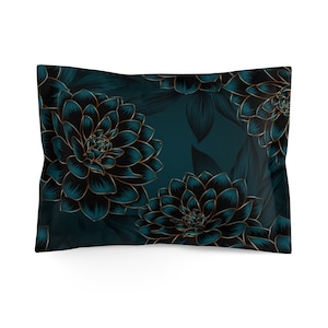 May include: A teal blue pillow with a floral pattern featuring black and gold flowers. The pillow is made of a soft, comfortable fabric and is perfect for adding a touch of elegance to any room.