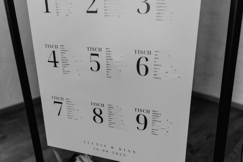 May include: A black and white seating chart for a wedding reception. The chart lists the names of guests assigned to each table, numbered 1 through 9. The chart is titled "Alexis & Kian" and the date "26.08.2023".