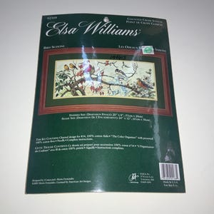 May include: An Elsa Williams counted cross stitch kit titled Bird Seasons. The packaging features a rectangular illustration of birds on branches with red leaves. It lists a finished size of 20 inches by 8 inches and a frame size of 24 inches by 12 inches.