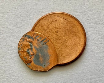 Trust Penny Error Penny: Avlång text, böjd platta - Samlarmynt med offset Lincoln-pennies
