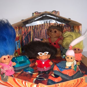 family of Scandinavian Trolls in a Wooden Troll House 1960s Dam Trolls Glass Spiral Eyes Wishnik Uneeda Dam Denmark vintage troll doll