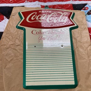 New Old Stock 1950s Fish Tail Coca Cola Metal Sign Wall Calendar Advertisement in original sleeve + handmade hanging quilt flag banner