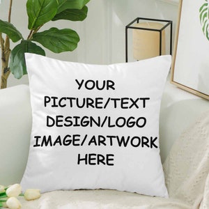 May include: White throw pillow with black text that reads "YOUR PICTURE/TEXT DESIGN/LOGO IMAGE/ARTWORK HERE".