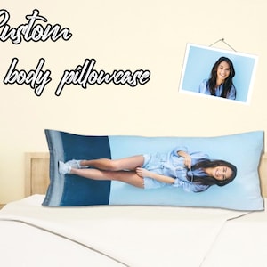 May include: A custom body pillowcase with a photo of a woman smiling. The pillowcase is blue and white and features a photo of a woman with long brown hair.
