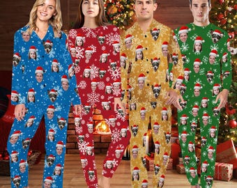 May include: Four people wearing matching Christmas pajamas with a snowflake and face pattern. The pajamas are red, blue, green, and yellow.
