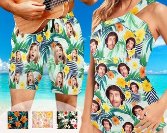 May include: A matching set of tropical print swimwear featuring a green, blue, and white floral pattern with various faces printed on the fabric. The text "Multiple Styles available..." is printed at the bottom of the image.