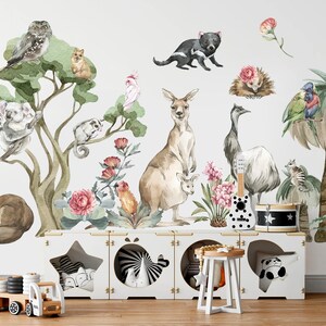 Children's bedroom showcasing hand-painted decals of koalas, kangaroos, emus, and Australian flora.