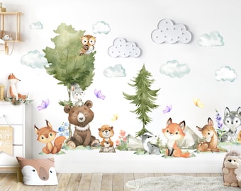 May include: A set of watercolor-style animal wall decals featuring a bear, fox, deer, owl, rabbit, badger, and wolf. The decals are surrounded by clouds and butterflies, creating a whimsical woodland scene.