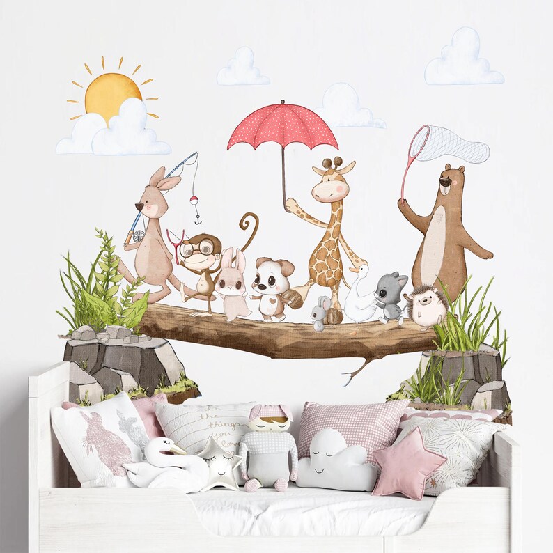 May include: A set of colourful animal wall decals featuring a giraffe, kangaroo, monkey, rabbit, hedgehog, bear, and a duck. The animals are walking on a tree branch with a red umbrella, a fishing rod, and a butterfly net. The decals are perfect for a nursery or child's room.