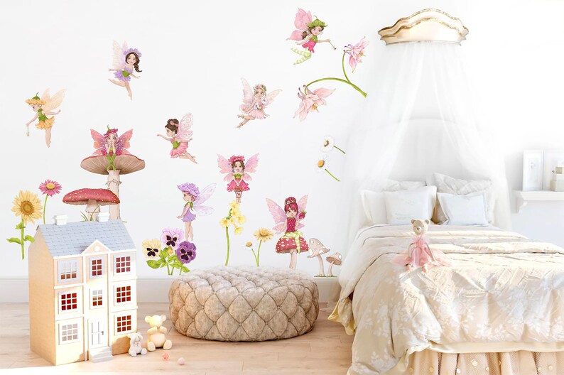 May include: A whimsical bedroom scene featuring fairy wall decals, a dollhouse, and a bed with a canopy. The fairies are depicted in various poses with colorful wings and dresses. Floral accents and mushroom decorations add to the fantasy theme.