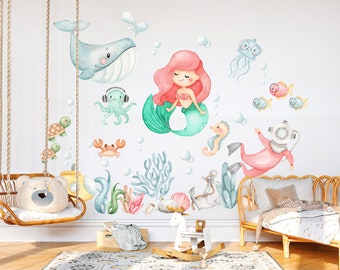 May include: A set of colorful watercolor-style wall decals featuring a mermaid, a whale, a crab, a turtle, a seahorse, an octopus, a jellyfish, a scuba diver, and coral. The decals are perfect for a child's bedroom or playroom.