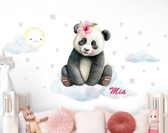 May include: A white wall with a panda bear sitting on a cloud with a pink flower on its head. The panda is surrounded by silver stars and clouds. The name "Mia" is written in pink below the panda.