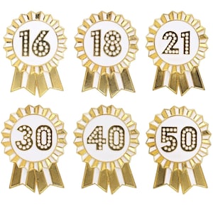 May include: Six gold and white rosette badges with numbers 16, 18, 21, 30, 40, and 50.
