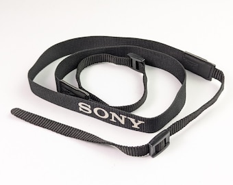 Zeldzame Sony cameradraagriem 18 mm zwart-witte tekst