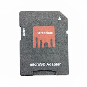 May include: Black microSD adapter with the word "Strontium" in a red rectangle. The words "microSD Adapter" are printed below the rectangle. The adapter has a lock switch.