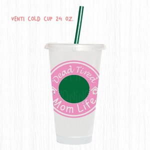 May include: A clear plastic Venti cold cup with a pink and green design. The cup has a green straw and a pink circle with the words "Dead Tired Mom Life" in white. The cup is 24 oz.