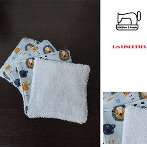 Könnte beinhalten: Ein Set aus fünf wiederverwendbaren Tüchern in Blau und Weiß mit einem Muster aus Tiergesichtern. Die Tücher sind aus einem weichen, saugfähigen Material gefertigt und eignen sich perfekt zum Aufwischen von Verschüttungen oder Flecken. Die Tücher sind übereinander gestapelt, wobei das oberste Tuch in der Hälfte gefaltet ist. Die Tücher liegen auf einer dunkelbraunen Holzoberfläche.