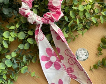 Pink spotty flower scrunchie with detachable tails