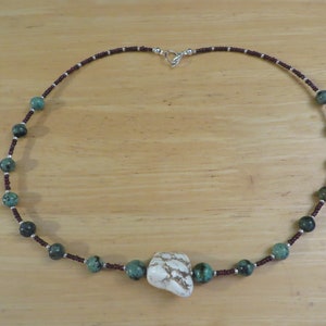Neckless with green stone beads and brown seed beads